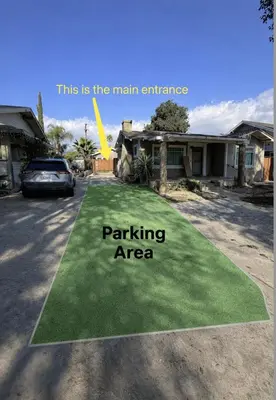 a yard of grass with a parking area at Brand new private Home with Yard free parking, near Ontario airport in Ontario