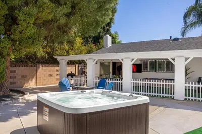 a hot tub in the backyard of a house at Stylish Getaway with Hot Tub in Northridge Hospital Heliport