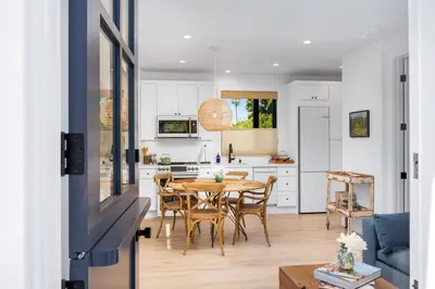 a kitchen and dining room with a table and chairs at NEW Venice Rose Ave Retreat with Sunset Deck in Los Angeles