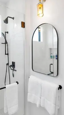 a bathroom with a mirror and white towels at NEW Venice Rose Ave Retreat with Sunset Deck in Los Angeles