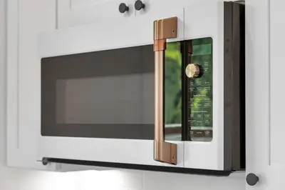 a microwave oven with a window in a kitchen at NEW Venice Rose Ave Retreat with Sunset Deck in Los Angeles
