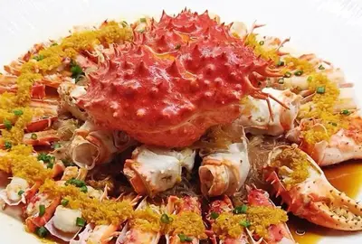 a plate of food with meat and sauce on it at YouPeng Seafood and GO Believe