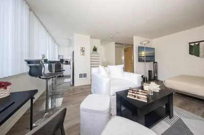 a living room with a couch and a bed at Beach-Close Santa Monica | Prime Location in Los Angeles