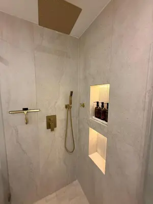 a bathroom with a shower with a sink and a shower at SkyLoft in Woodland Hills