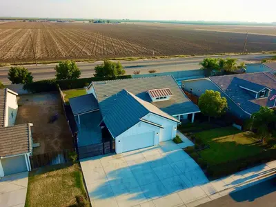 an overhead view of a house with a field at Spacious Home with Private Pool in Bakersfield