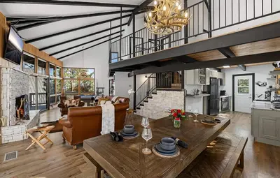 a kitchen and living room with a table and a couch at Beautiful Wrightwood Chalet in Wrightwood
