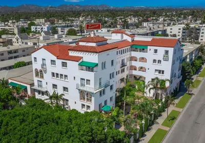an aerial view of a white building with a red roof at The Sovereign in Los Angeles