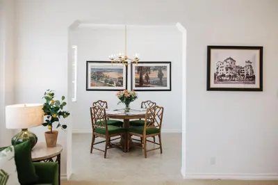 a dining room with a table and chairs at The Sovereign in Los Angeles
