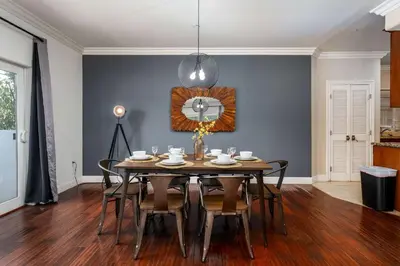a dining room with a table and chairs at Stylish Home Prime Location with Fireplace & Patio in Los Angeles