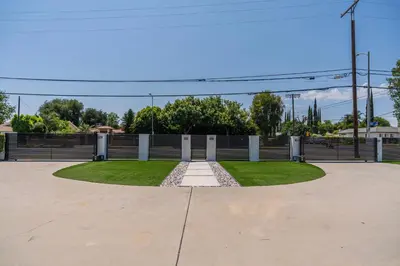 a park with a fence and grass at Luxury Summer Getaway in Encino in Van Nuys Airport