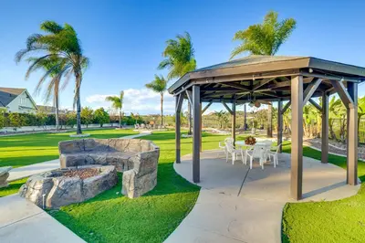 a pavilion with a table and chairs in a park at Expansive Riverside Mansion! Luxe, Family Friendly in Riverside