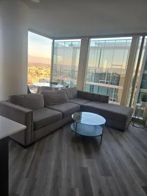a living room with a couch and a table at 2 Bedroom with City Views in Los Angeles