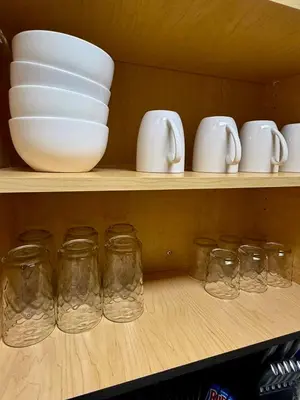 a shelf with bowls and mason jars on it at The Luxe Marina HideAway in Los Angeles