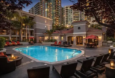 a swimming pool with chairs and a building at Demo3 in Los Angeles