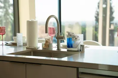 a kitchen counter with a sink and a window at LA Hype Spot Sunset x Fairfax SkyView in Los Angeles