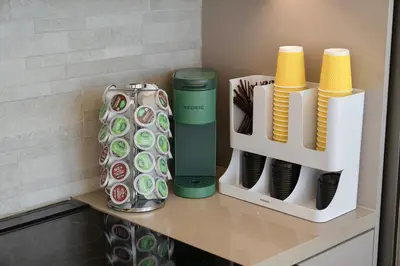 a shelf with cups and a vase on a counter at LA Hype Spot Sunset x Fairfax SkyView in Los Angeles