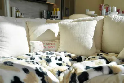 a couch with pillows and a blanket on it at LA Hype Spot Sunset x Fairfax SkyView in Los Angeles