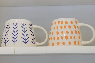 two coffee mugs sitting on a shelf at 5 bedroom home 2 miles from Loma Linda Medical in Loma Linda