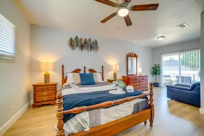 a bedroom with a bed and a ceiling fan at Family-Friendly Home 2 Mi to Dtwn Riverside in Riverside