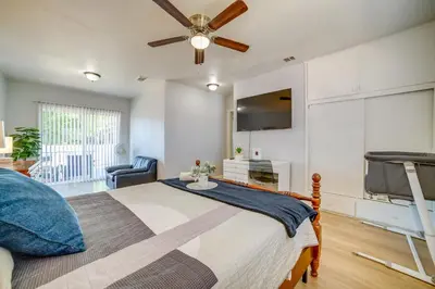 a bedroom with a bed and a ceiling fan at Family-Friendly Home 2 Mi to Dtwn Riverside in Riverside