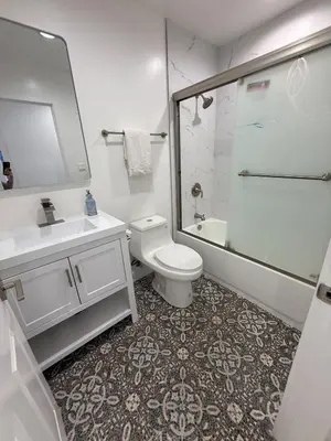 a bathroom with a toilet and a sink and a shower at Brand New Home, Great Location, Monthly Discounts in Woodland Hills