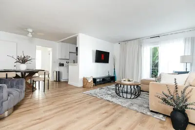 a living room with a couch and a table at Serene Urban Haven in Los Angeles