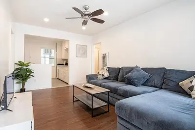 a living room with a blue couch and a table at Affordable 1BR apt near Beverly Hills in Los Angeles