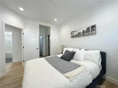 a bedroom with a large white bed in a room at Holiday Home Modern Home by Interhome in Westminster
