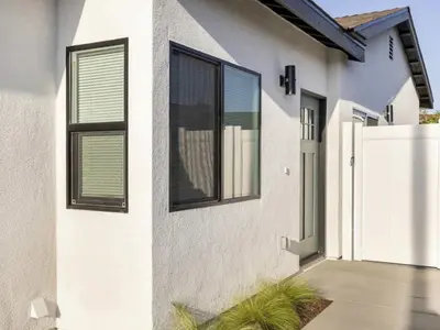 a white house with windows and a driveway at Holiday Home Modern Home by Interhome in Westminster