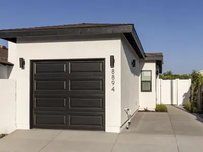 a garage with a black garage door on a house at Holiday Home Modern Home by Interhome in Westminster