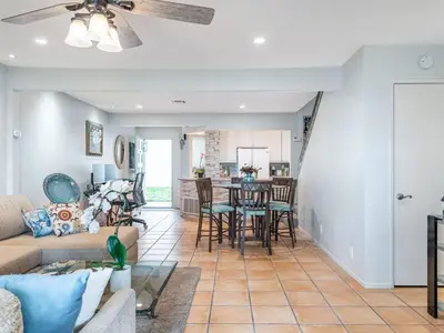 a living room with a couch and a table at Apartment Meerblick Eigentumswohnung gegenüber dem Strand by Interhome in Port Hueneme