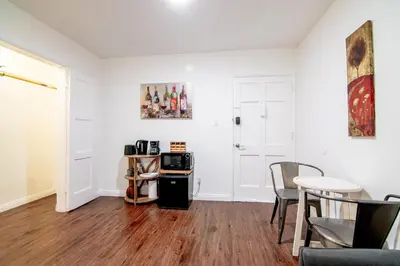 a living room with a table and a microwave at Relaxing 1 Bedroom Suite Near Beverly Hills in Los Angeles