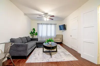 a living room with a couch and a ceiling fan at Relaxing 1 Bedroom Suite Near Beverly Hills in Los Angeles