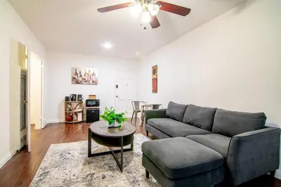 a living room with a couch and a table at Relaxing 1 Bedroom Suite Near Beverly Hills in Los Angeles