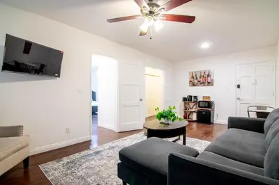 a living room with a couch and a ceiling fan at Relaxing 1 Bedroom Suite Near Beverly Hills in Los Angeles