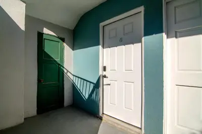 an empty room with a door and a staircase at Freshly Renovated Studio for Two in the Heart of LA in Los Angeles