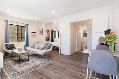 a living room with a couch and a table at Upper-Level Studio Suite Close to Beverly Hills in Los Angeles