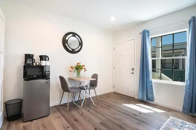 a room with a table and chairs and a window at Upper-Level Studio Suite Close to Beverly Hills in Los Angeles