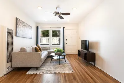 a living room with a couch and a tv at Affordable One-Bedroom Close to Pico and Beverly Hills in Los Angeles