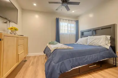 a bedroom with a bed and a ceiling fan at Southbaysunshine coastal Villa by beach-30 plus Days in Torrance