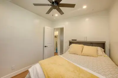 a bedroom with a bed with a ceiling fan at Southbaysunshine coastal Villa by beach-30 plus Days in Torrance