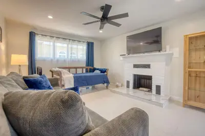 a living room with a couch and a fireplace at Southbaysunshine coastal Villa by beach-30 plus Days in Torrance