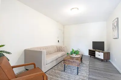 a living room with a couch and a tv at Comfortable 1B 2beds Retreat Near Beverly Hills in Los Angeles