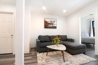 a living room with a couch and a table at Comfortable 2Bedroom apartment close to Beverly Hills in Los Angeles