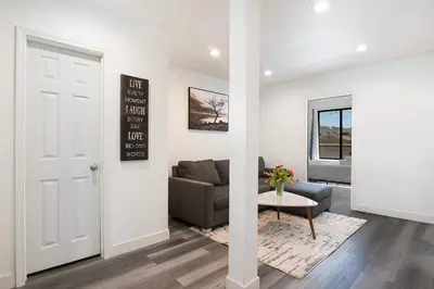 a living room with a couch and a table at Comfortable 2Bedroom apartment close to Beverly Hills in Los Angeles