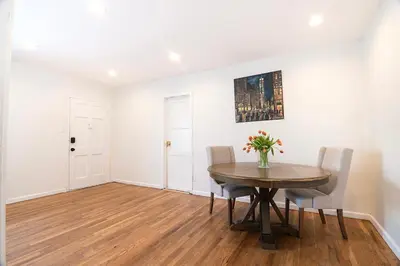a dining room with a table and chairs at Comfortable One-Bedroom with Two Queen Beds in Los Angeles