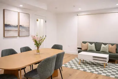 a living room with a table and a couch at Calm Luxe Ensuite Room near USC-Shared Home in Los Angeles