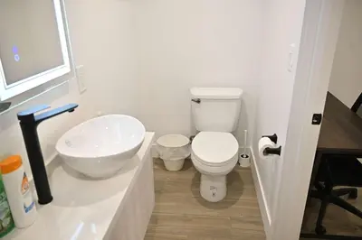a bathroom with a white toilet and a sink at Calm Luxe Ensuite Room near USC-Shared Home in Los Angeles
