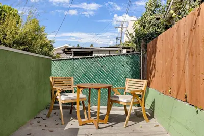 a table and two chairs and a wooden table and chairs at Family Retreat Near Disneyland & Downtown LA 4BR in Los Angeles
