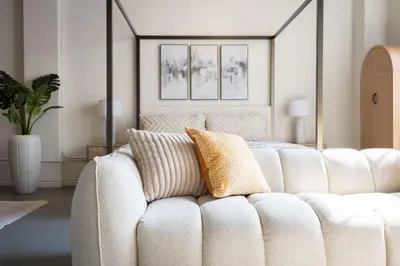a white couch in a living room with a bed at DTLA Boutique Loft w Rooftop Pool Hot Tub in Los Angeles